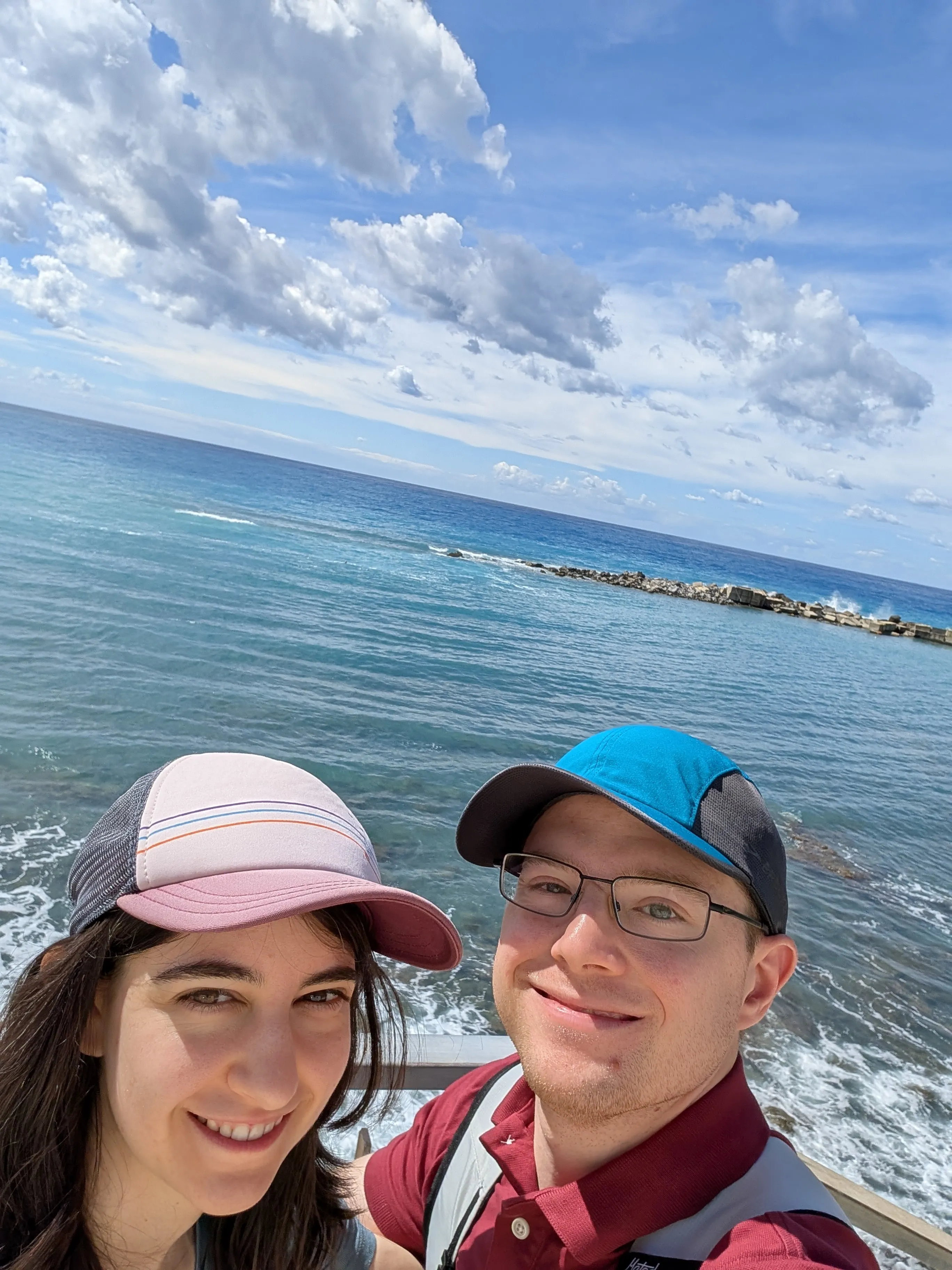 Gabby & Travis looking out over the water in Diamante